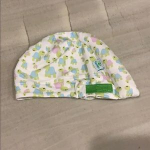 Infant tortle hat for torticollis.